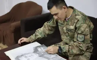 Портреты героев Великой Отечественной войны: военнослужащий Национальной гвардии сохраняет память о мужестве